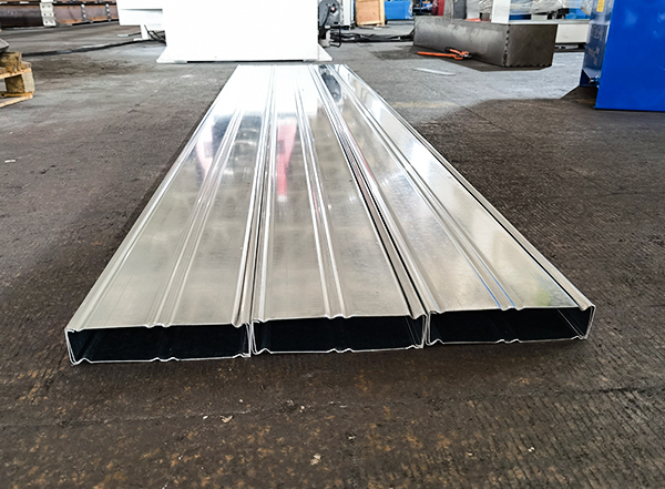 Finished galvanized box beams produced by SUNWAY machine, showing stiffening ribs and interlocking seams
